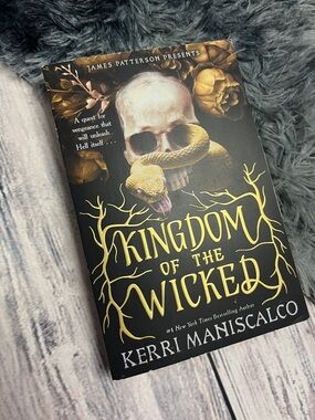 Paperback copy of Kingdom of the Wicked by Kerri Maniscalco
